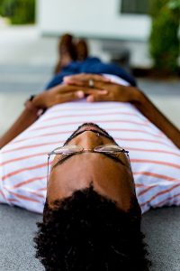 person lying down whilst undergoing hypnosis for pain relief
